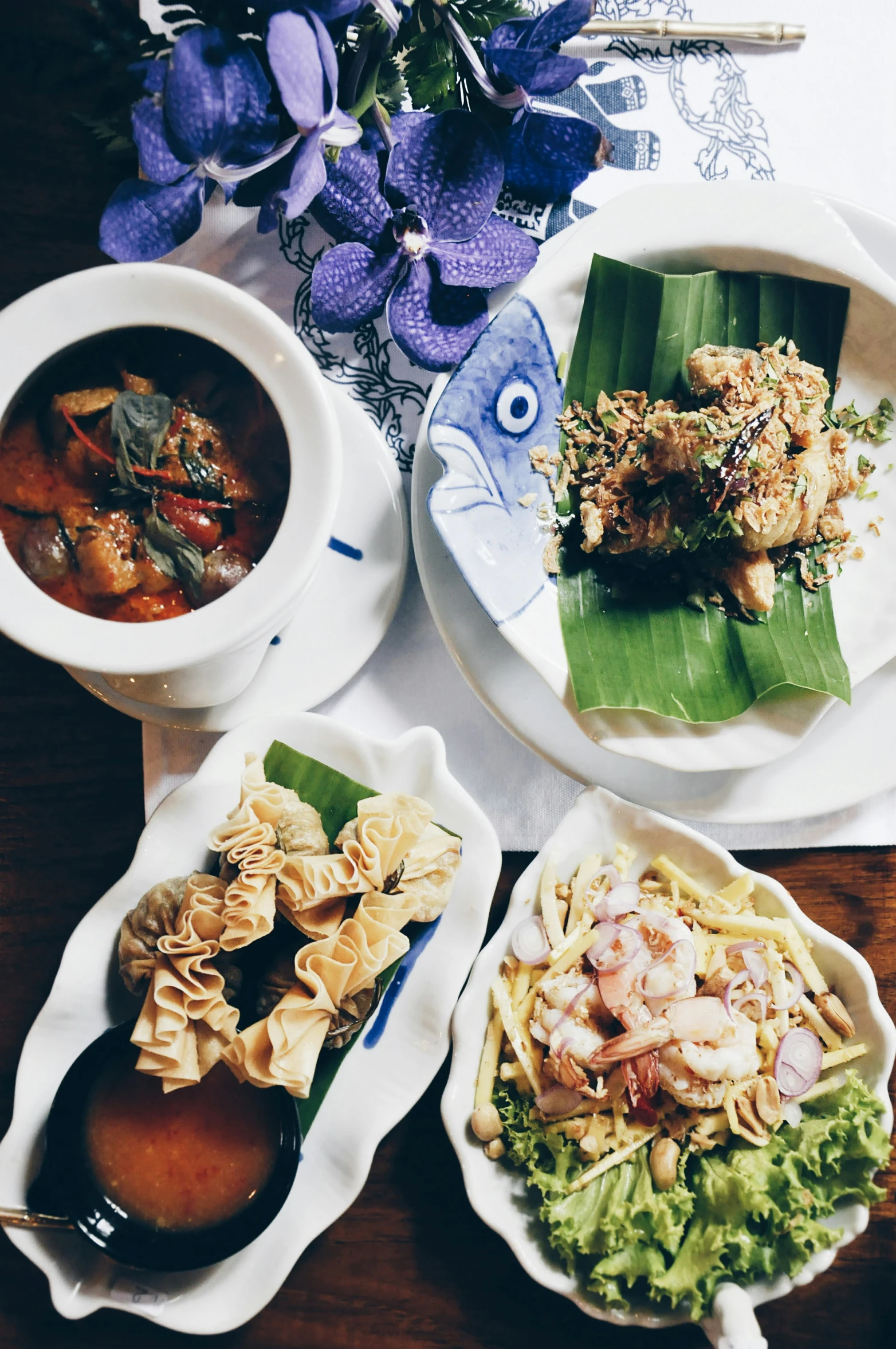 plates of food that includes vegetables and soup