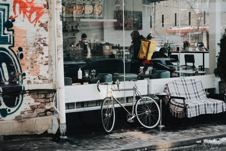 two bikes are parked outside a shop front window