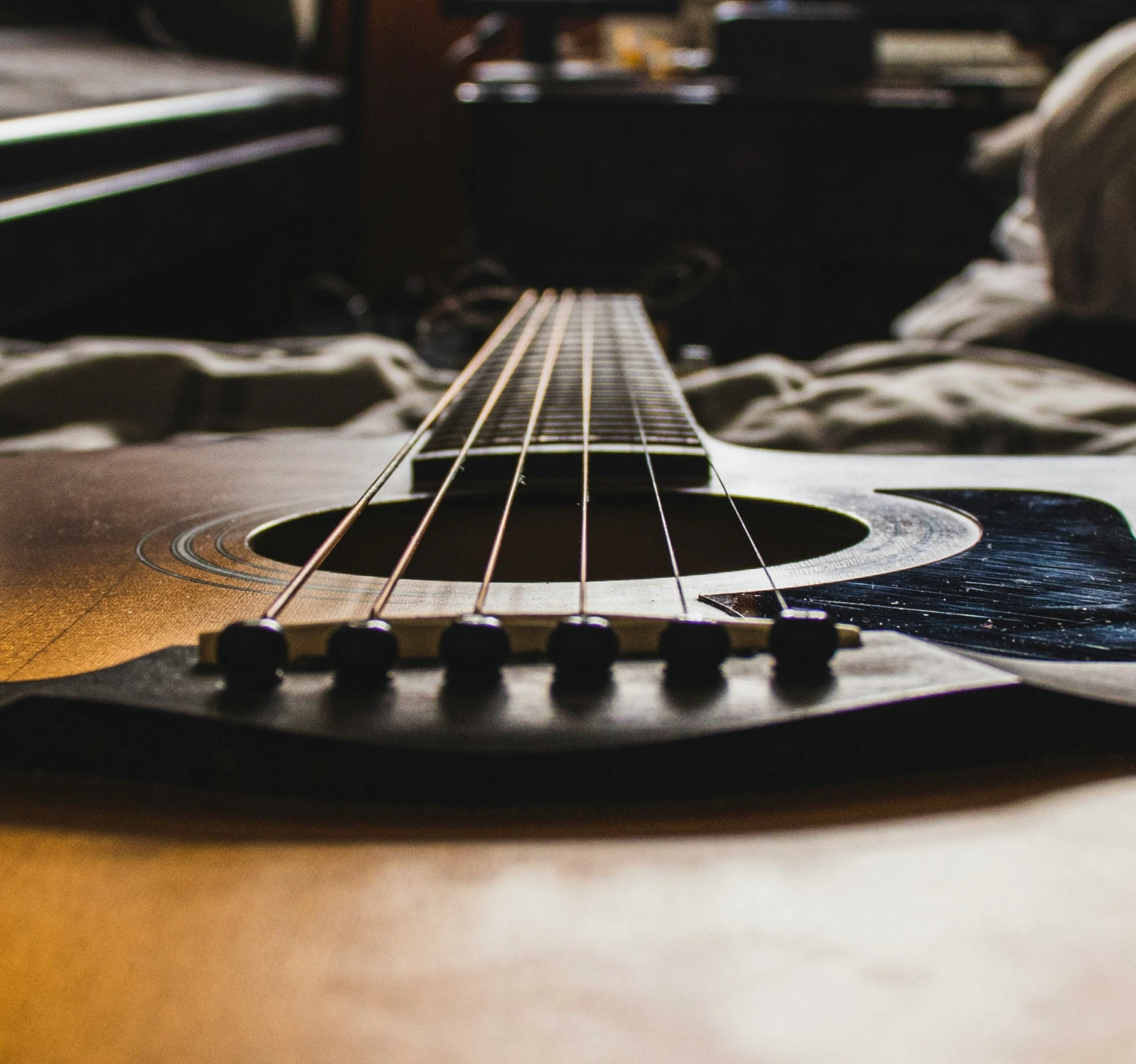 closeup of a guitar fret lying on a bed