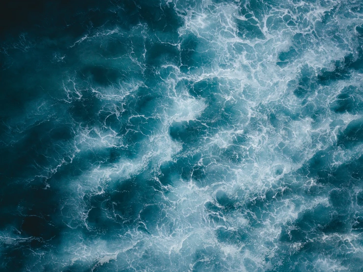 the surface of a body of water with small, circular waves