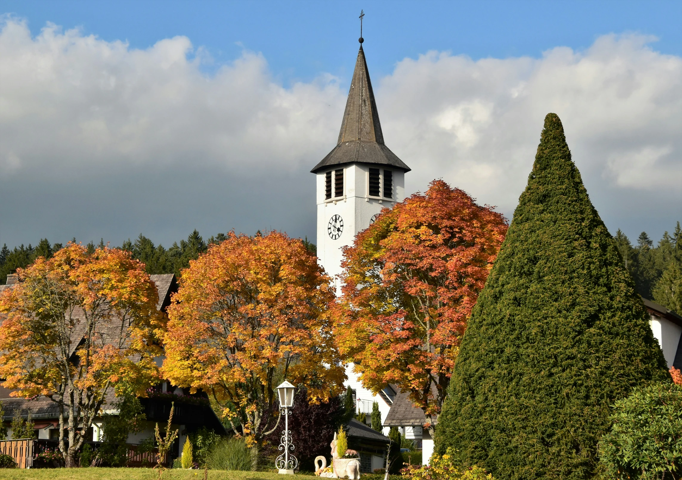 an old style building with trees around it