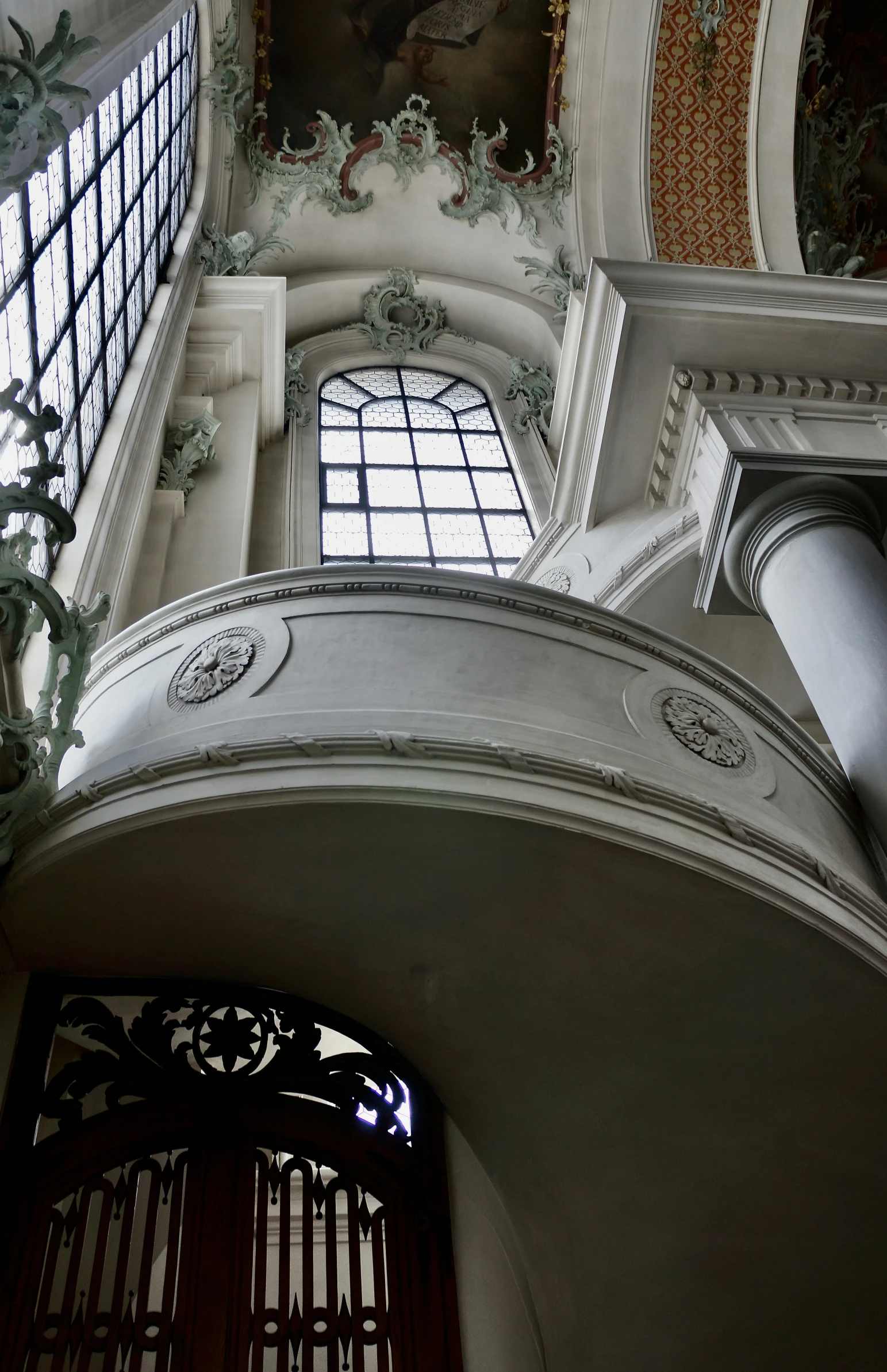 an arch is above the clock on a building