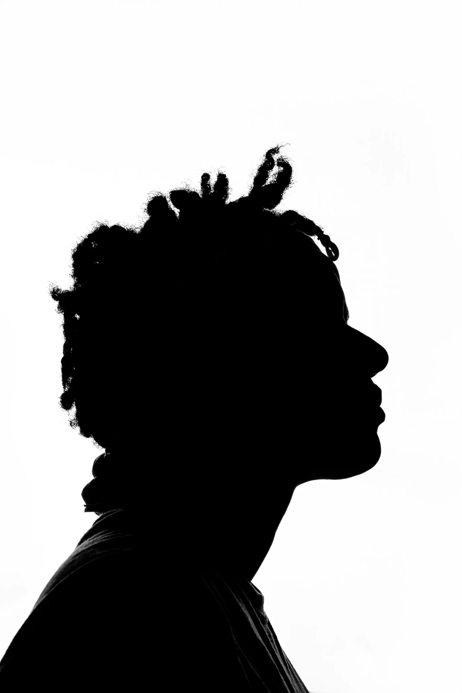 black and white pograph of a person with dreads