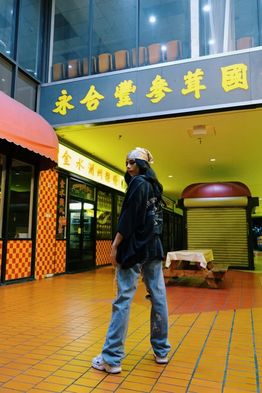 a man stands in the middle of a shopping center