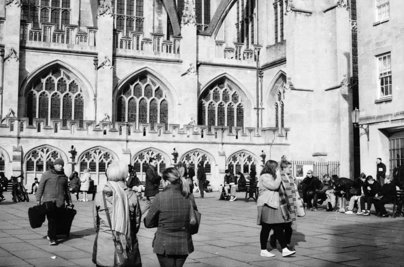 group of people in the courtyard of a church