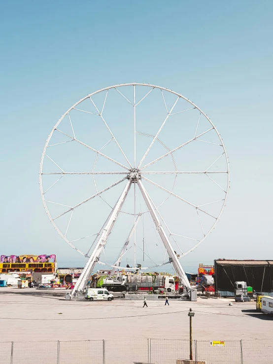 the large ferris wheel stands at a fairground