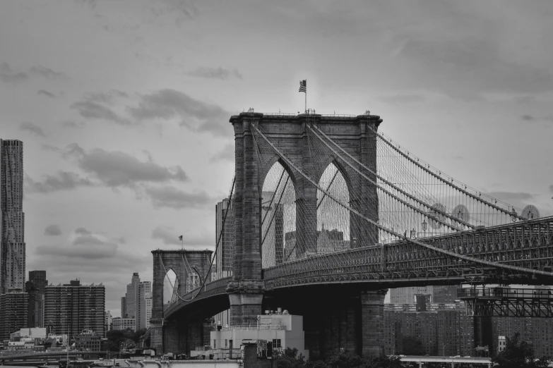 the brooklyn bridge with a reflection of two virgins painted on it