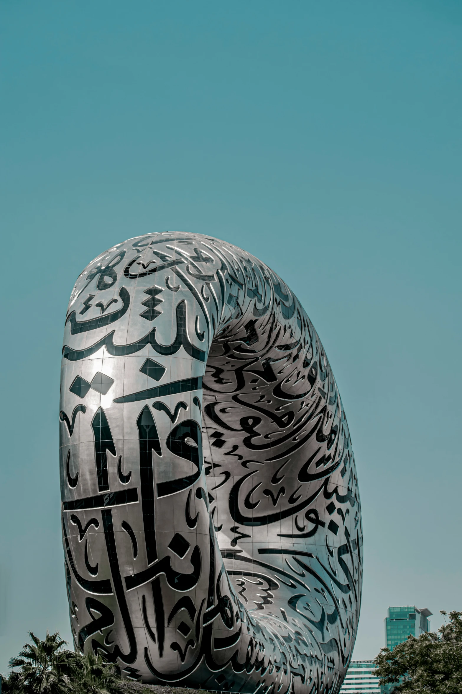 a large metal statue sitting on top of a field