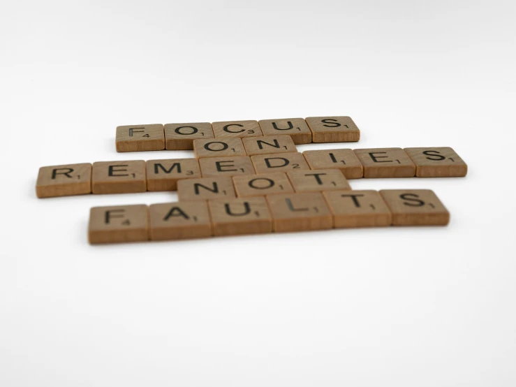 a bunch of letters that are laying on top of some kind of tiles