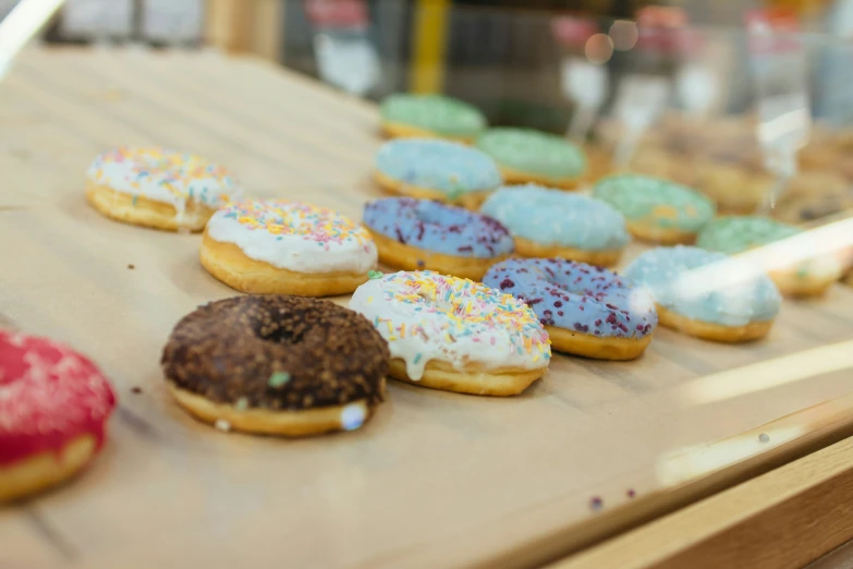 a table with some assorted donuts sitting on it