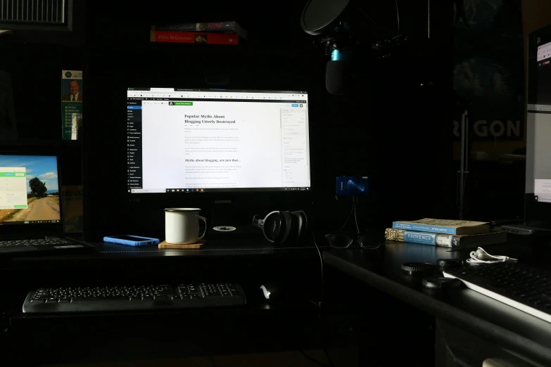 two computer screens on desk with keyboard and mouse