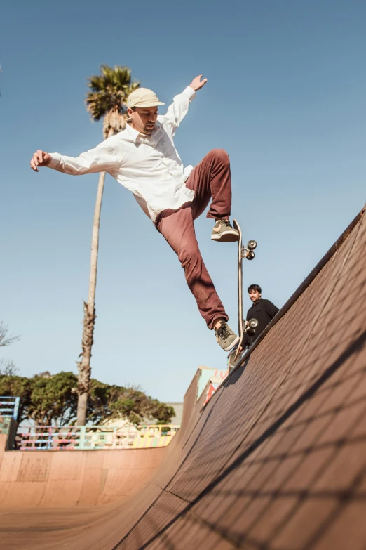 a person riding a skate board on a ramp