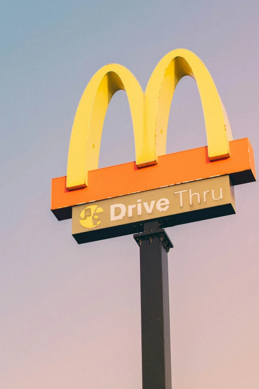 a large sign that has two yellow arches