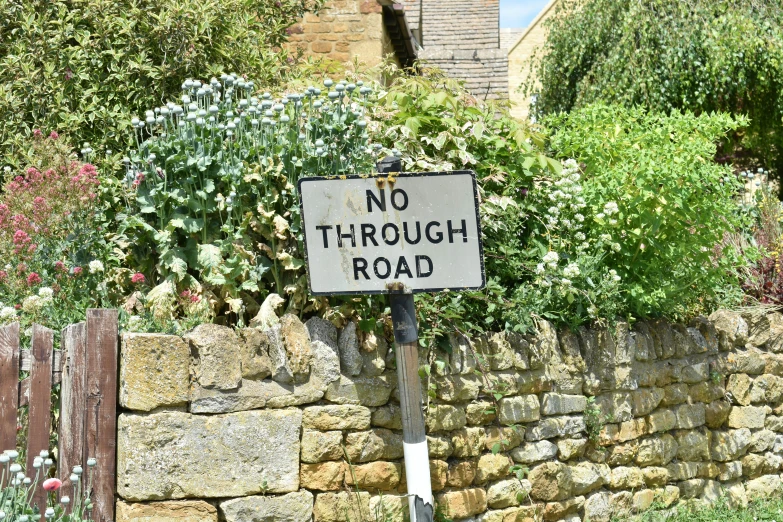 a sign stating it's time to go through the road