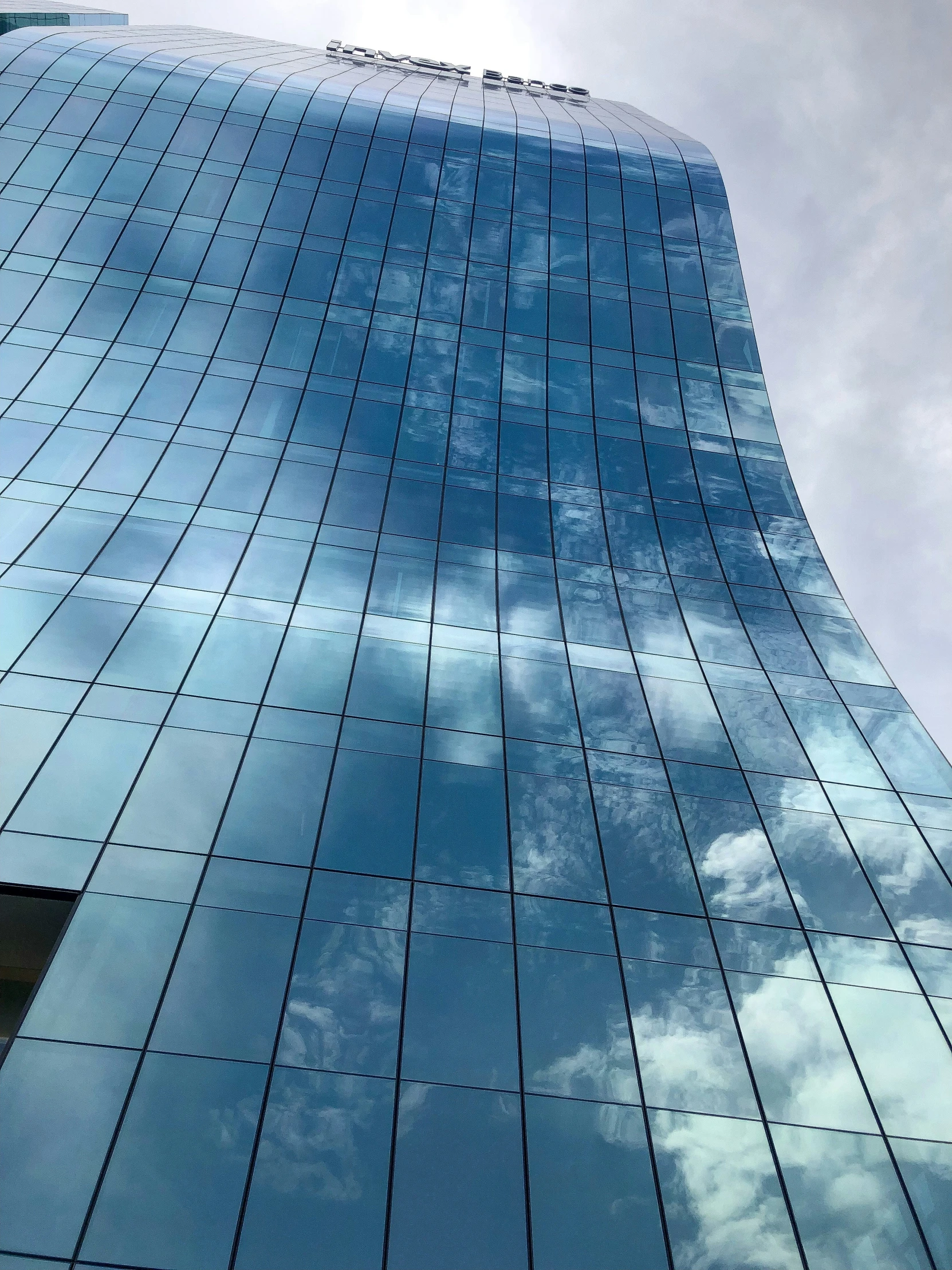 the top of the glass windows in an office building