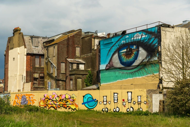 an image of an eye painted on a building in the city