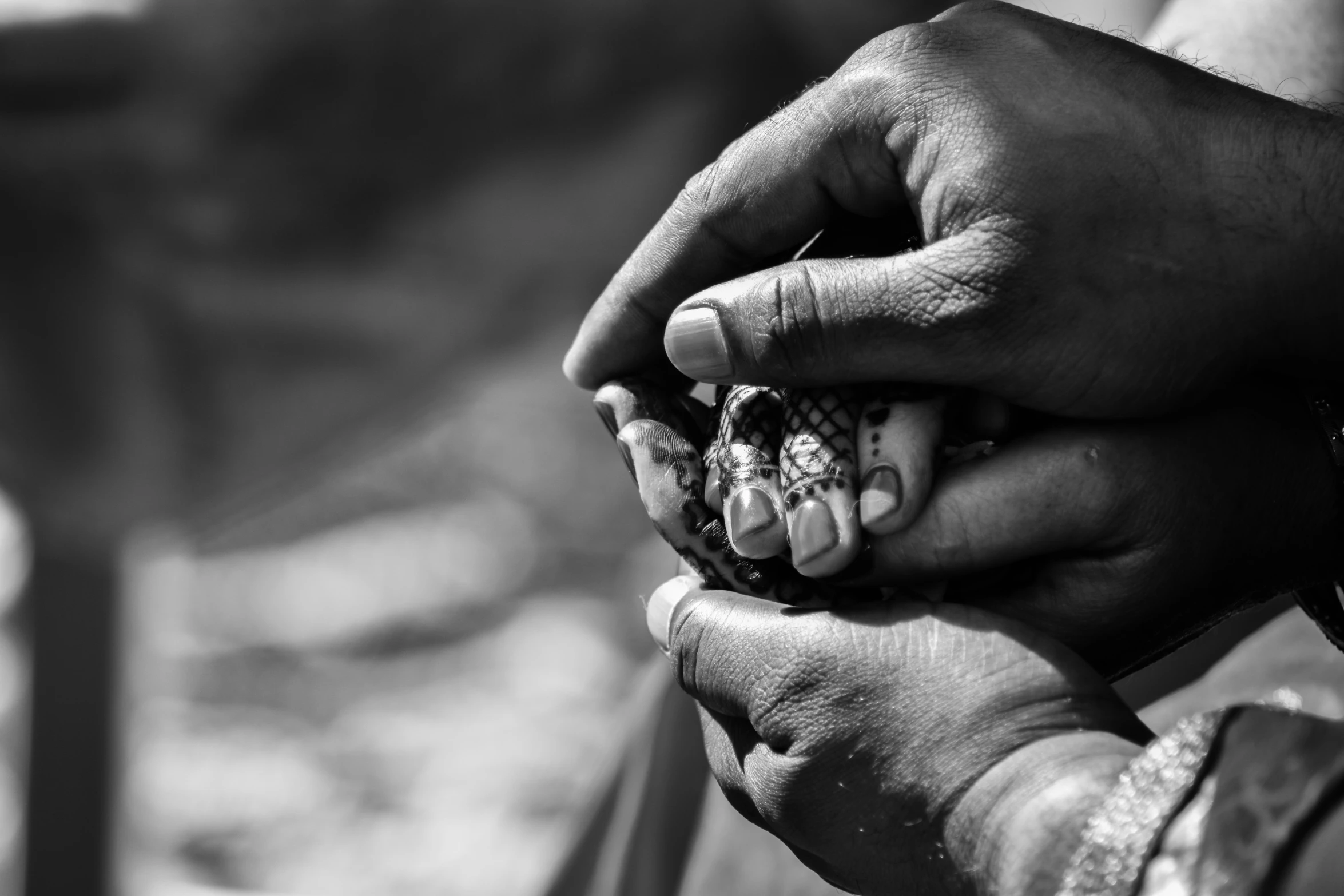 hands holding soing small, black and white