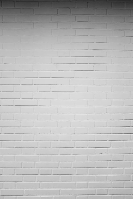 an old brick wall with a wooden door