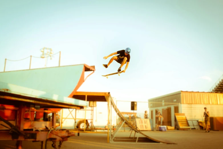 a man in a full body suit is doing tricks on skateboards