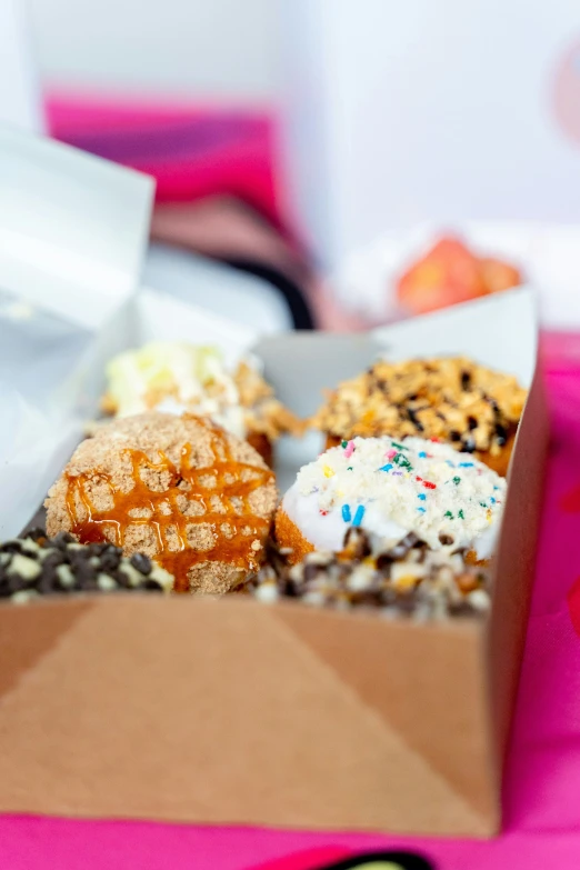 the food in the box has frosted waffles and sprinkles