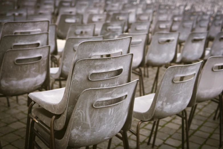 some chairs with white seats on one side and white seats to the other