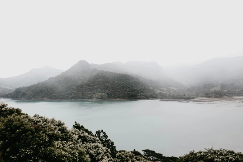 a lake surrounded by mountains and hills