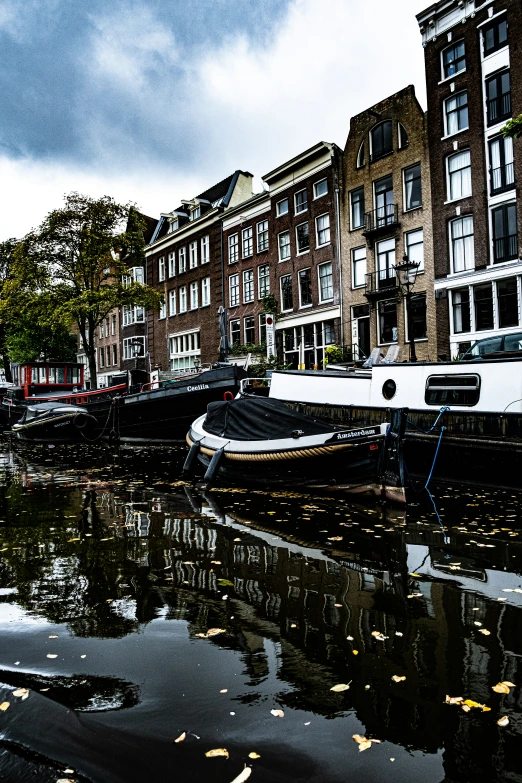 boats and buildings along the water at a dock