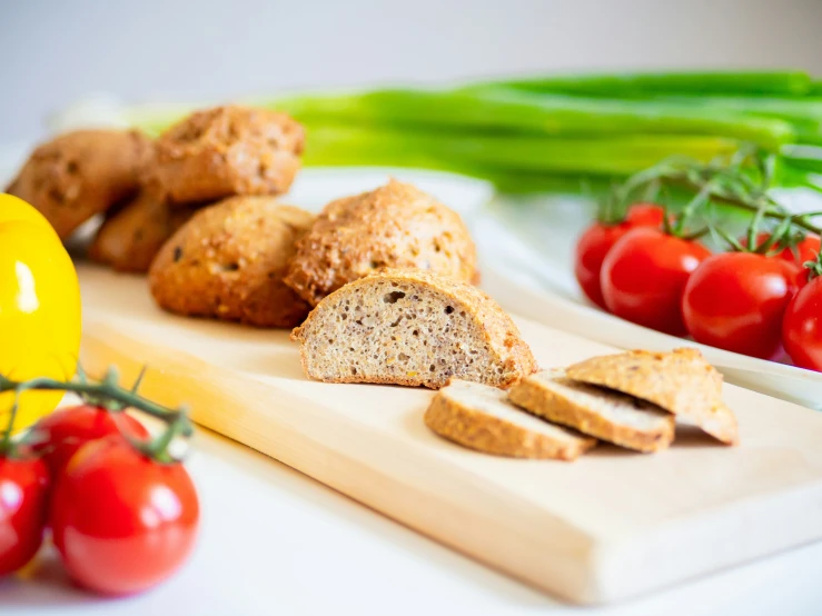 fresh bread with tomatos and green vegetables on  board