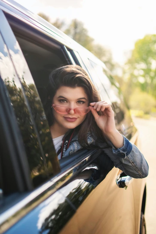 the woman has her face taken out the window