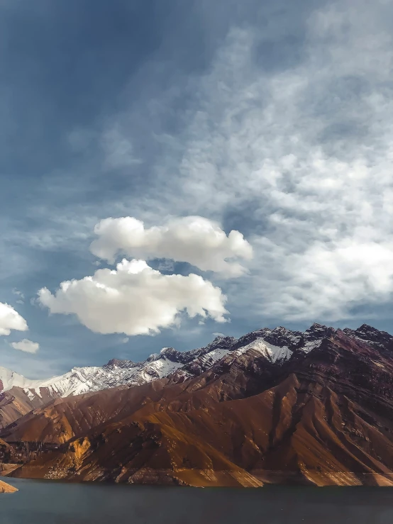 a beautiful view of mountains under a cloudy sky