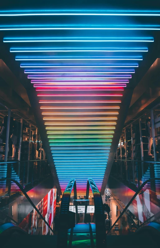 a hallway with colorful lights and bars