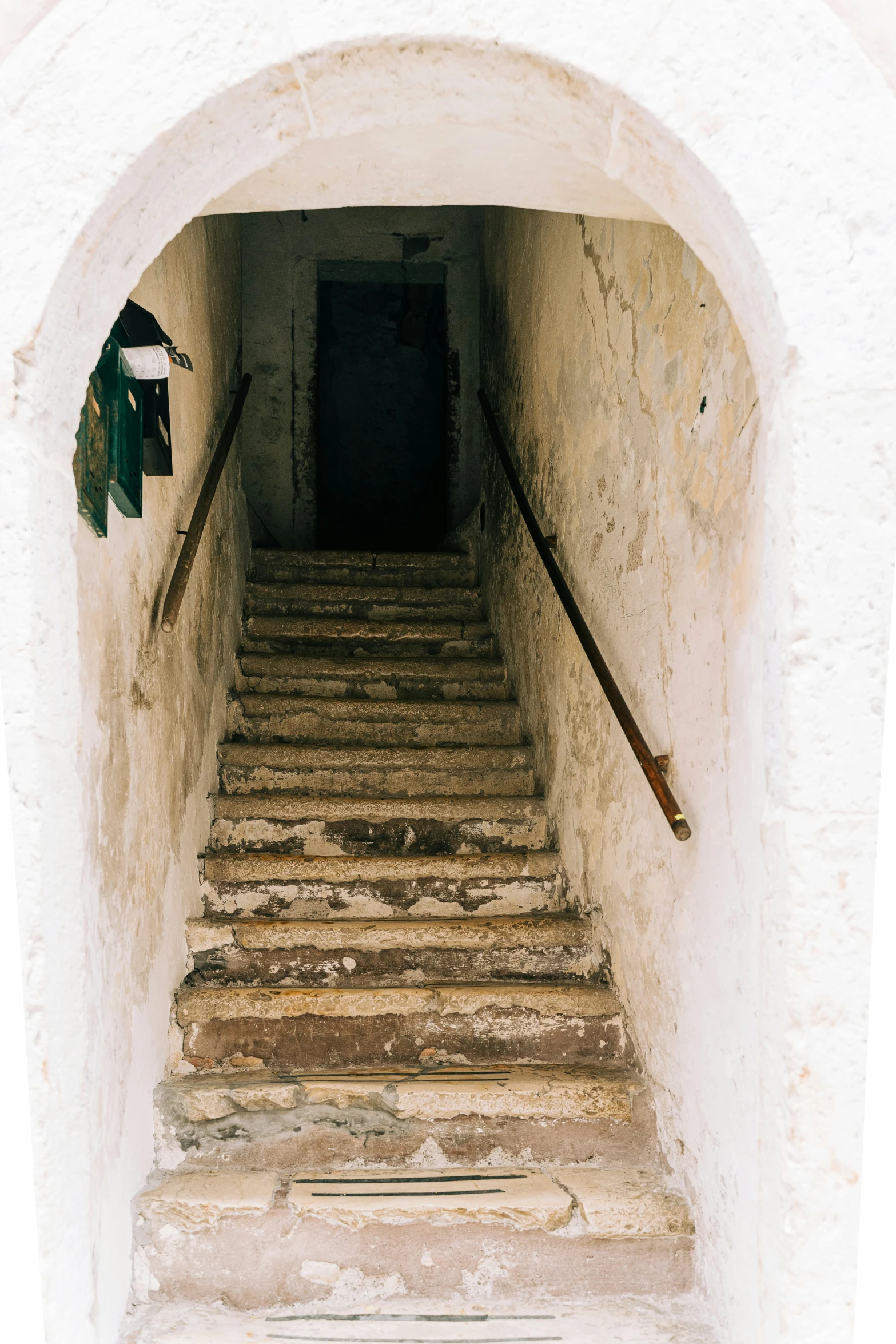 a set of steps leading to a black door