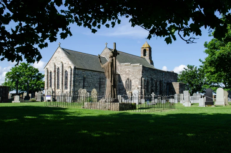 an old church in the middle of a cemetery