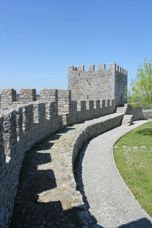 a large castle like structure with some stone walls