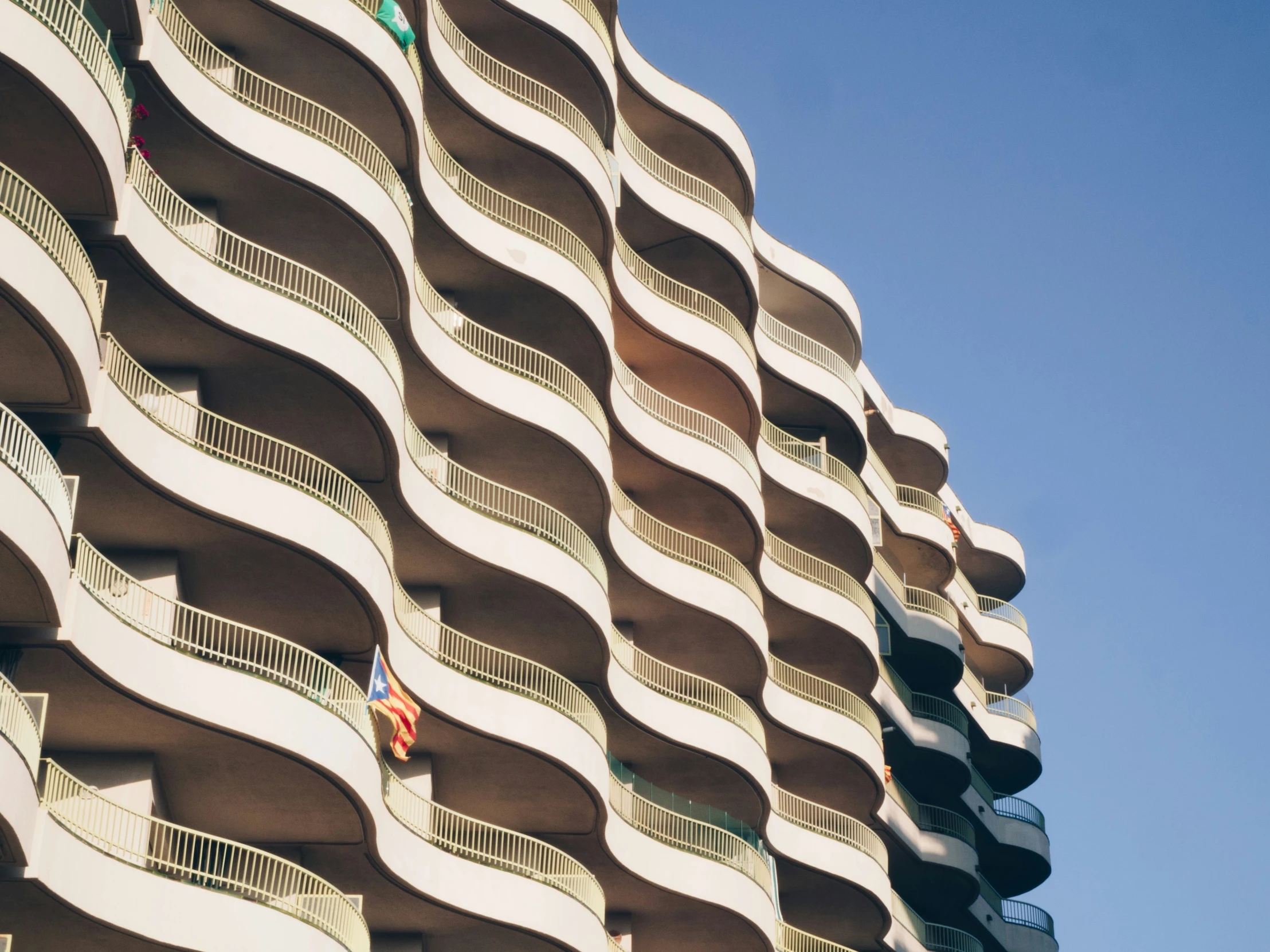 an apartment building with balconies on each floor