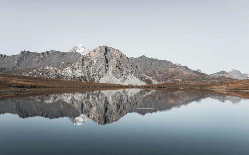 a lake with a mountain in the background