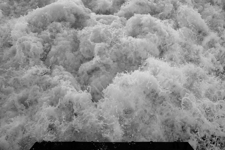 an overhead view shows the ocean water that is covering the top of its surface