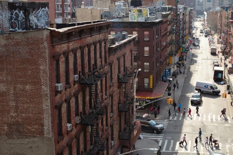 an image of a city with people walking down the street