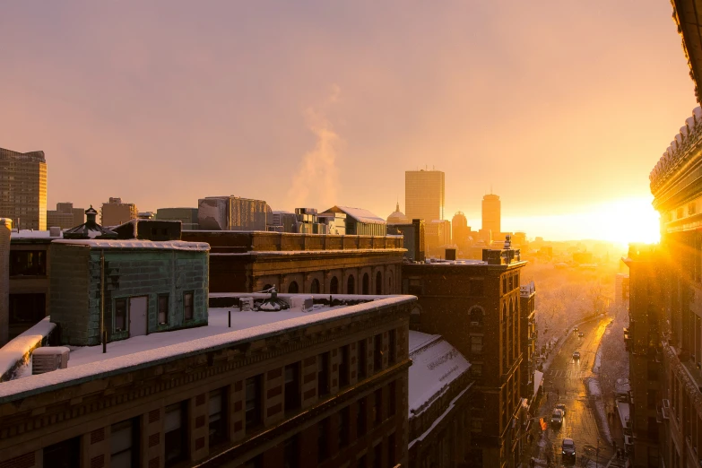 a city street at sunset with the sky in view