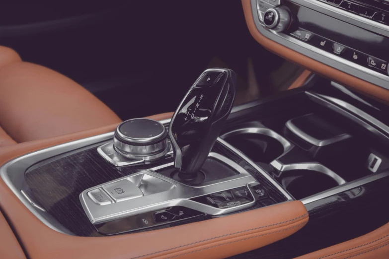 an automatic car steering wheel with leather and a gear shift