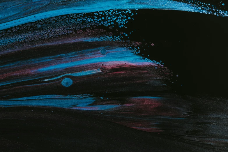 a painting with black and blue watercolors and pink