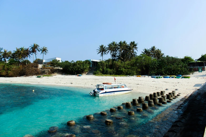 a long boat on the beach near a shore