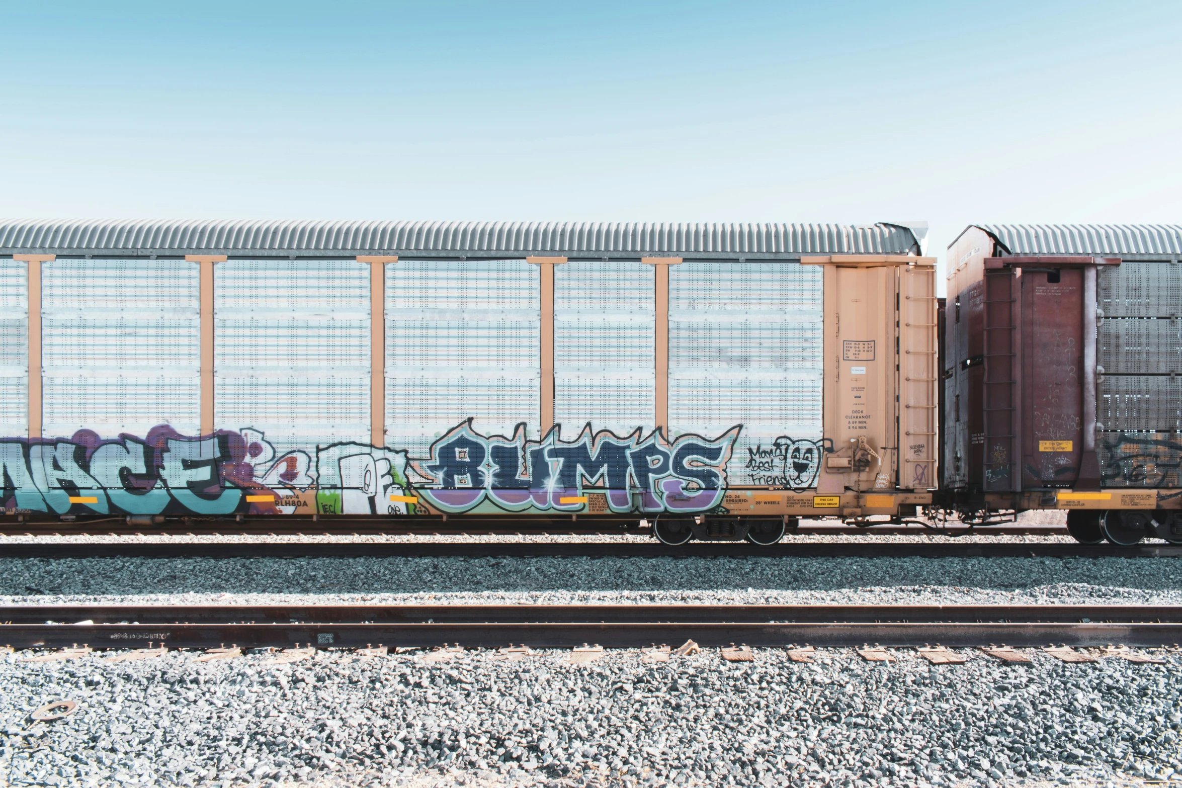 a train car with graffiti written on it's side