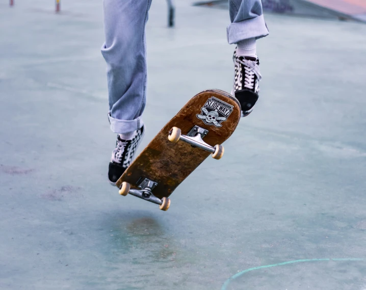 a skateboarder is about to land in the concrete