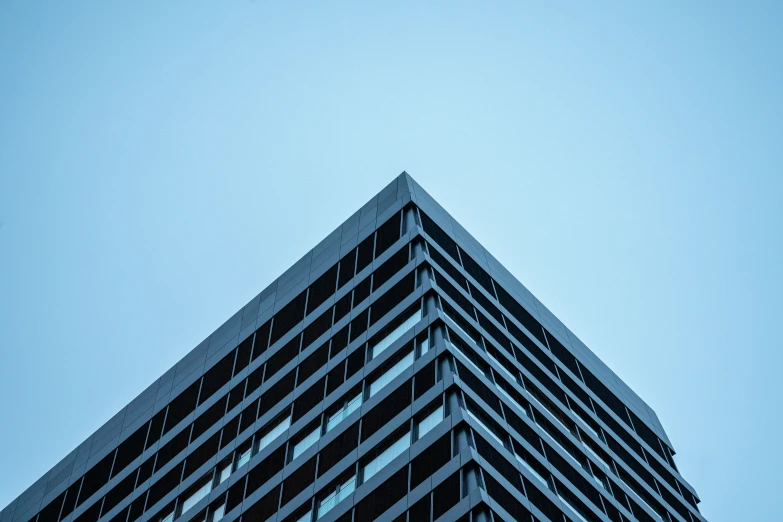 the building is tall in the blue sky