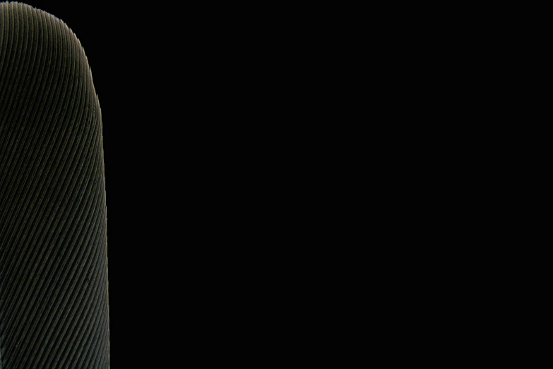 a skateboard is sitting against a black background