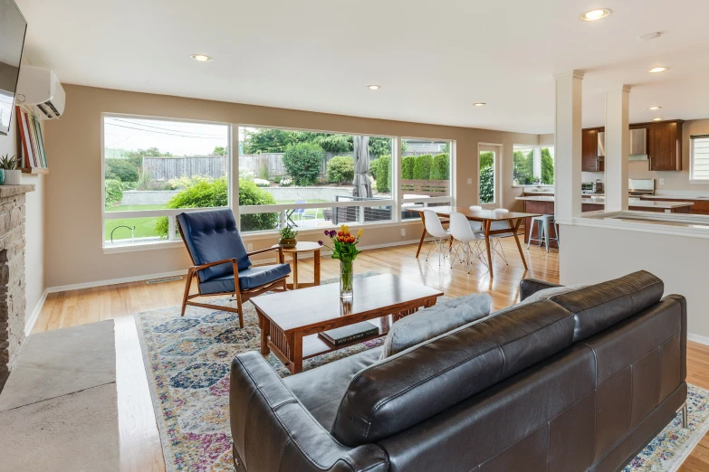 living area with sofa, coffee table and fireplace