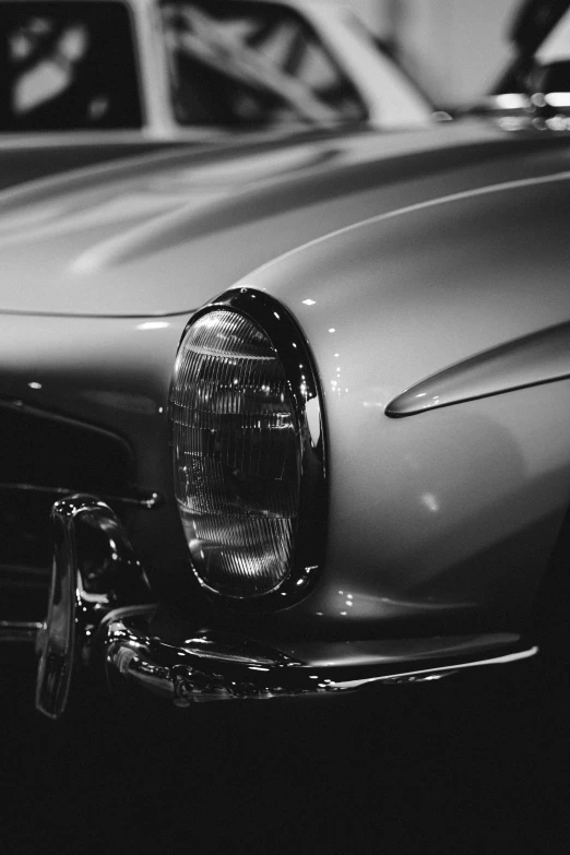 a black and white image of an older car