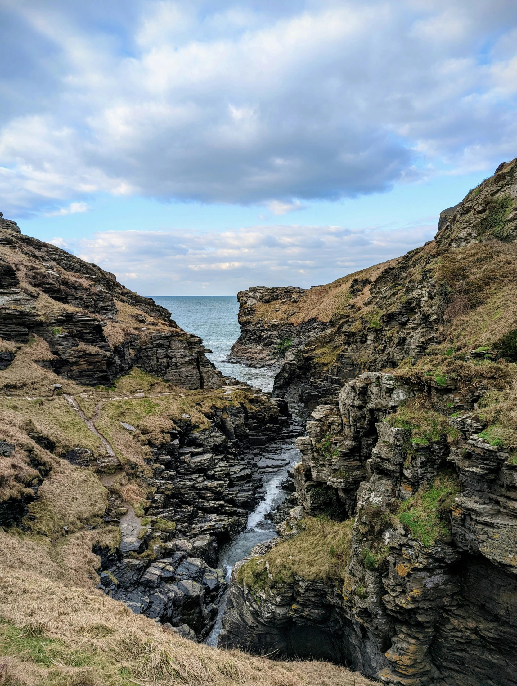 an image of a small creek going into the ocean