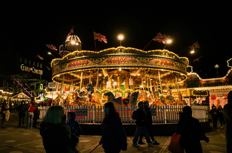 the amut park rides and merry go round at night